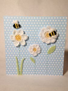 Hand stitched and crocheted, bumblebee and flowers card.