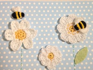 Hand stitched and crocheted, bumblebee and flowers card.